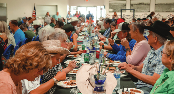 VIPs enjoy lunch at the fair on July 15.