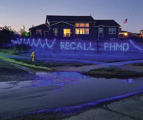 A house is lit up with blue lights indicating Recall FHMD