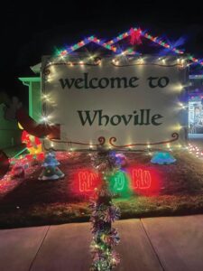 A welcome to whoville sign in front of a house