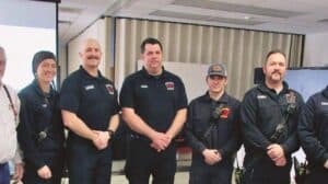 A group of firefighters posing for a photo