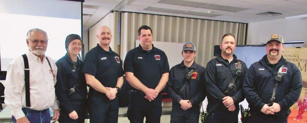 A group of firefighters posing for a photo