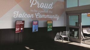 A sign that says proud to be a falco community