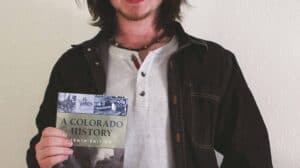 Coben Scott holding a book