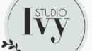 A round, light green logo with "Studio Ivy" in large text and "Hair • Nails" in smaller text at the bottom, featuring a small branch graphic.