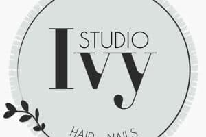 A round, light green logo with "Studio Ivy" in large text and "Hair • Nails" in smaller text at the bottom, featuring a small branch graphic.