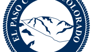 Seal of El Paso County, Colorado, showing stylized mountains in the center, surrounded by a rope border and the text “El Paso County Colorado Est. 1861.”